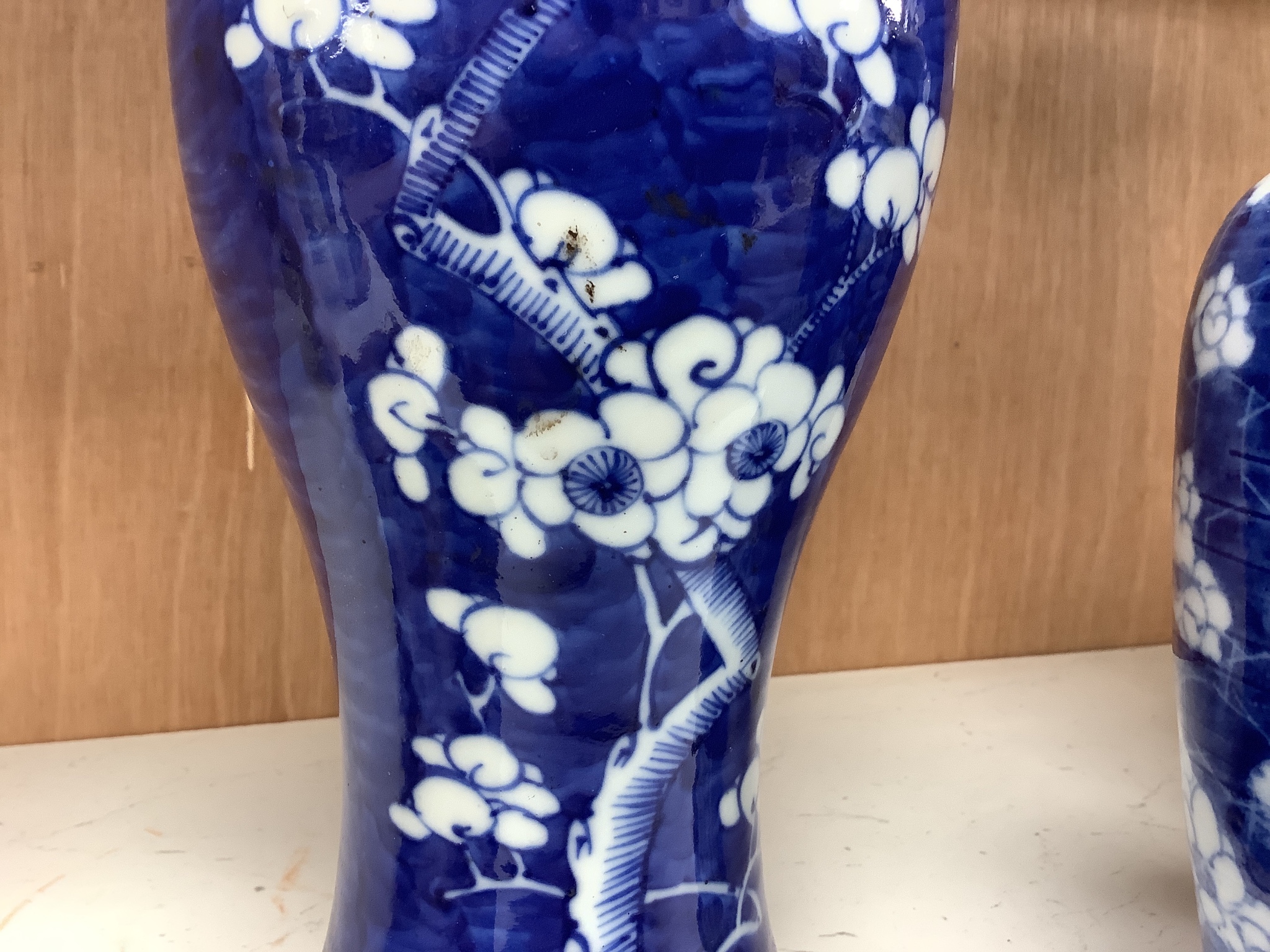 A pair of late 19th century Chinese prunus blossom baluster vases, 30cm, and a Japanese ovoid vase